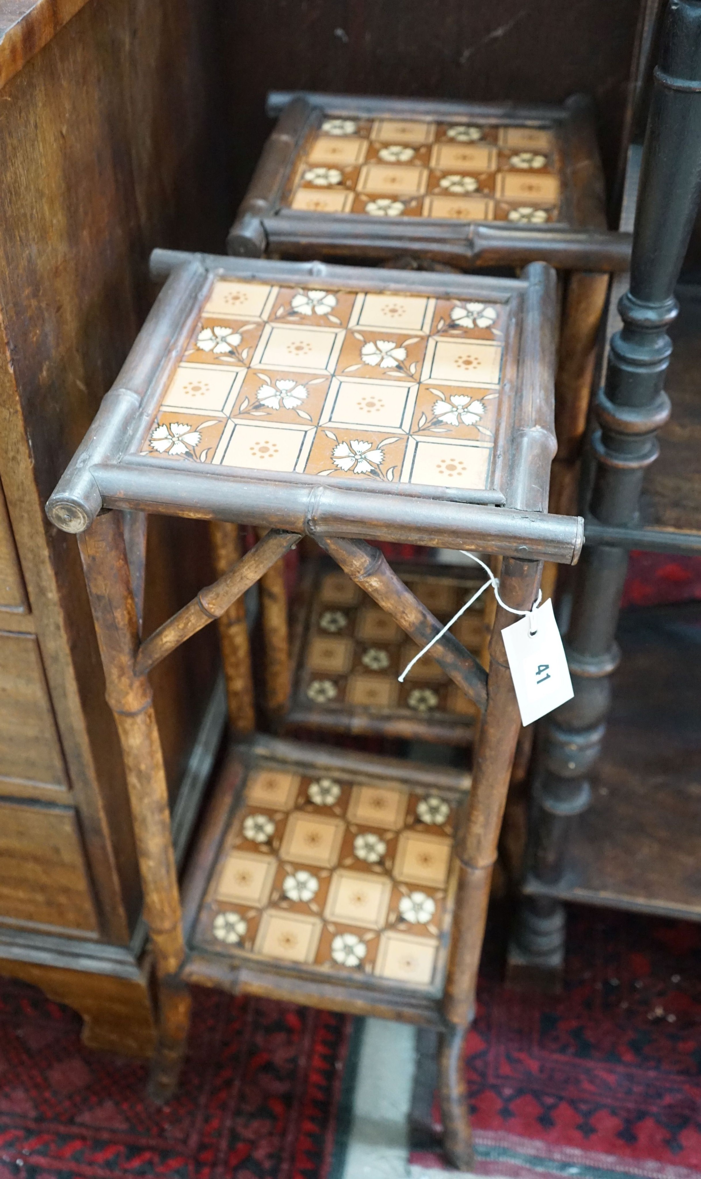 A pair of late Victorian tiled bamboo two-tier plant stands, height 74cm